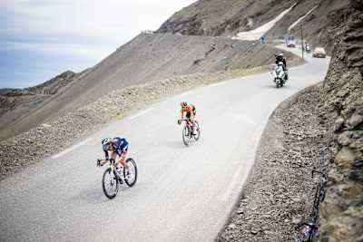 Jai Hindley of Red Bull - BORA - hansgrohe powers down Cime de la Bonette at 2,802m during stage 19 of the 2024 Tour de France, racing from Embrun to Isola 2000, France.