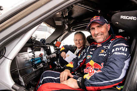 A photo of Stéphane Peterhansel and Andrea Peterhansel at the pitstop ahead of the third stage of the 2019 Abu Dhabi Desert Challenge.