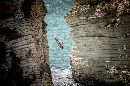 Gary Hunt of the UK dives from the 25m cliff in Raouché during the first competition day of the fifth stop of the Red Bull Cliff Diving World Series in Beirut, Lebanon on July 13, 2019.