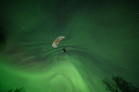 Jeffrey Provenzano skydiving under Alaska's Northern Lights