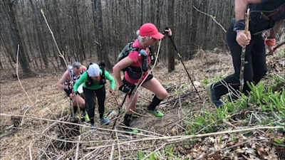 Competitors use poles during the Barkley Marathon to get up steep climbs.