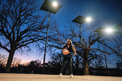 Arike shooting around under the newly installed lights at Crawford Park.