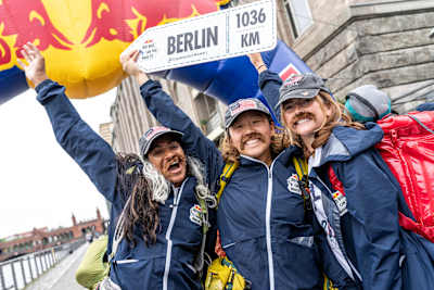 A Red Bull Can You Make It? team celebrates reaching the finish line in Berlin, Germany on May 28, 2024.