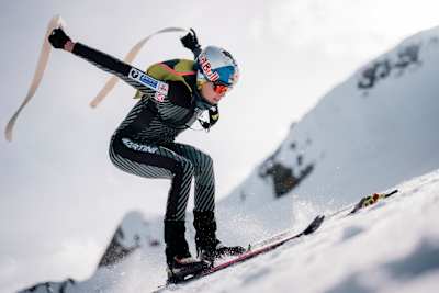 Paul Verbnjak removes his skins during a ski mountaineering race.