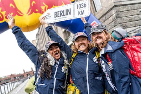 A Red Bull Can You Make It? team celebrates reaching the finish line in Berlin, Germany on May 28, 2024.