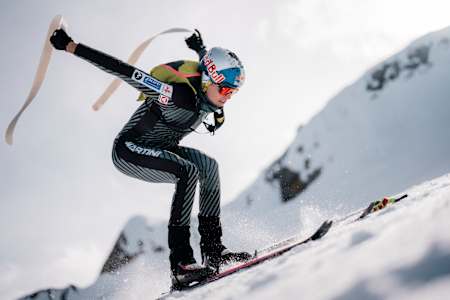 Paul Verbnjak removes his skins during a ski mountaineering race.