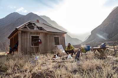 Adrian Mattern outside a mountain hut during his kayaking expedition to the Sary-Jaz river in Kyrgyrzstan's Tian Shan mountains.