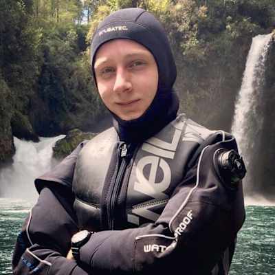 Max Struck poses for a picture beside a waterfall at the Red Bull Cliff Diving World Series competition in Lago Raco in Chile.