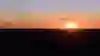 Turner twins paraglide at sunset in the Australian outback.