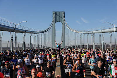Runners cross the Verrazano Bridge as they compete in the New York Marathon in New York on November 2, 2025. 