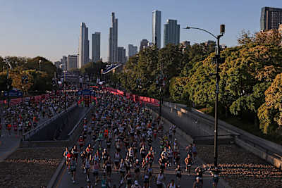 Waves of runners make their way through the 2025 Bank of America Chicago Marathon course on October 12, 2025 in Chicago, Illinois. 