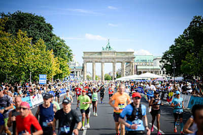 Runners running through the Brandenburg Gate during the 2025 BMW Berlin Marathon on September 21, 2025 in Berlin, Germany.