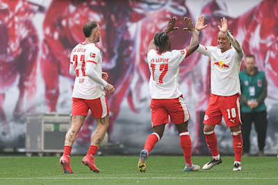  Ridle Baku of RB Leipzig celebrates with Xavi Simons after scoring the team's second goal during the Bundesliga match between RB Leipzig and VfB Stuttgart.