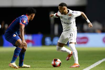 Neymar Jr of Santos drives the ball against Matheus Fernandes of Red Bull Bragantino during a match between Santos and Red Bull Bragantino as part of Campeonato Paulista 2025 quarter-final.