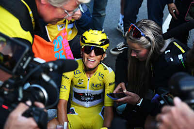 Overall winner Pauline Ferrand-Prévot sits and smiles after finishing stage 9 of the Tour de France Femmes in 2025.