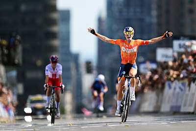 Demi Vollering crosses the finish line as gold medal winner ahead of Kasia Niewiadoma-Phinney in the road race at the UCI Road World Championships in Montreal, Canada. 