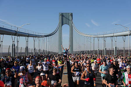 Runners cross the Verrazano Bridge as they compete in the New York Marathon in New York on November 2, 2025. 