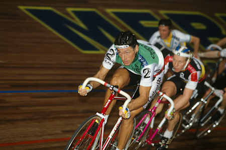 Francesco Moser races at an indoor velodrome.