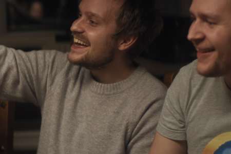 An image of JerAx laughing with friends.