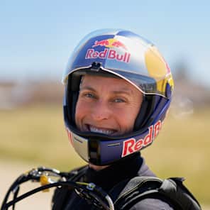 Katie poses for a picture after receiving her Red Bull helmet in April 2026.