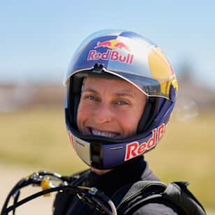 Katie poses for a picture after receiving her Red Bull helmet in April 2026.