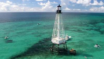 Lighthouse seen in turquoise water in Florida.