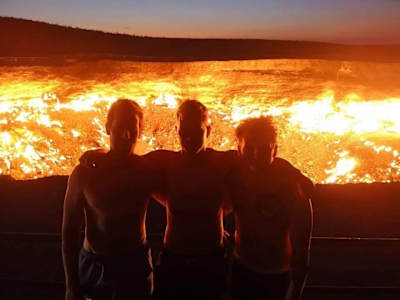 A photo of DJ Krakota's Mongol Rally team in front of Turkmenistan's 'Gates Of Hell'.