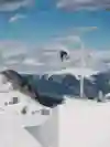 Ukrainian snowboarder Dima Luchkin flies through the air in the Alps during filming of Burton My Turn.