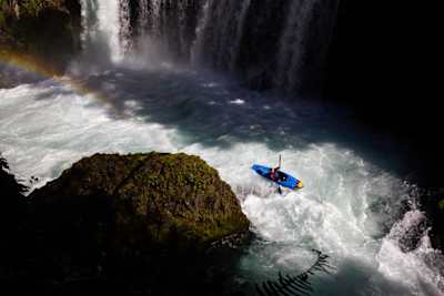 Nouria Newman riding her kayak into wild waters during a photo shoot in France on March 22, 2022.