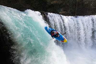 Nouria Newman riding down a waterfall during a photo shoot in France on March 22, 2022.  