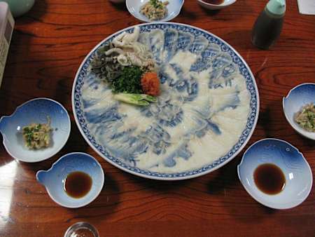 Plate with sushi on it.