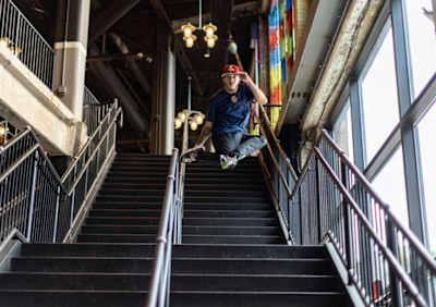 A lifestyle shot of El Nino dancing on stairs
