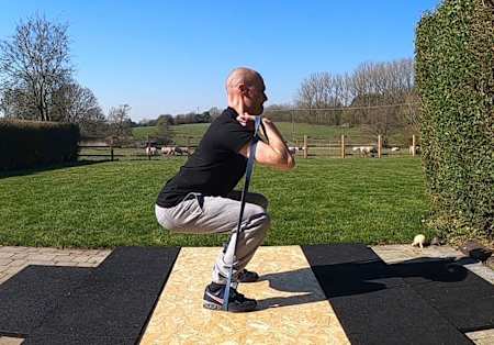 Banded front squat bodyweight exercise
