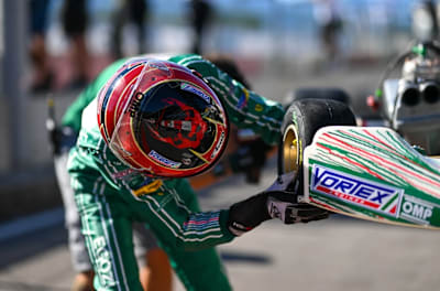 James Egozi assisting with a quick tyre change on his Tony Kart