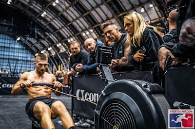 Jake's on the rowing machine during a HYROX event