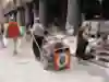 Global walker Angela Maxwell towing her gear outside a market in Turkey.