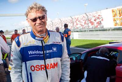 Renowned motorsport racing circuit designer Hermann Tilke pictured in his racing overalls.