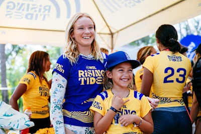Caity Simmers hanging with local kids in El Salvador, for WSL Rising Tides.