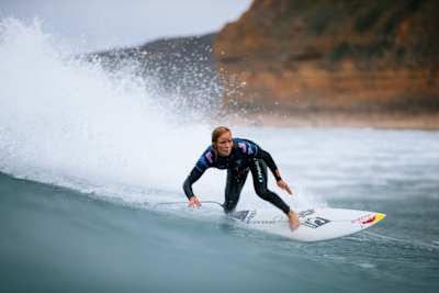 Caity Simmers bottom turns at Bells Beach