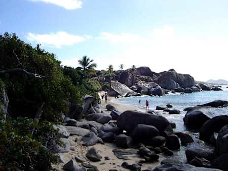 The Baths, Virgin Gorda, BVI, showing evidence of the island's volcanic origins, as huge granite boulders lie in piles on the beach forming scenic grottoes that are open to the sea.