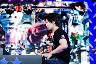 Fighting game pro Daigo ‘The Beast’ Umehara on stage, deep in concentration.