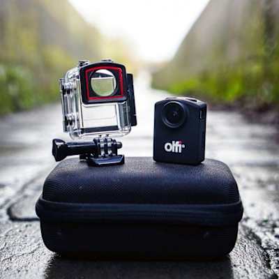 The Olfi One.Five Black 4k Action Camera pictured outdoors.