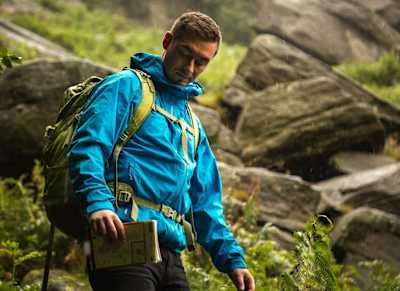 Hiker wears Mammut Kento Jacket.