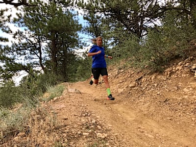 Ultra Runner Courtney Daulwater running on home trails in Colorado