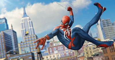Spider-Man swings between buildings in a screenshot from Marvel’s Spider-Man game.