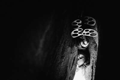 Pamela Shanti Pack at Indian Creek, Utah, United States. Seen through a rock crack by Jeremiah Watt for Red Bull Illume 2016.