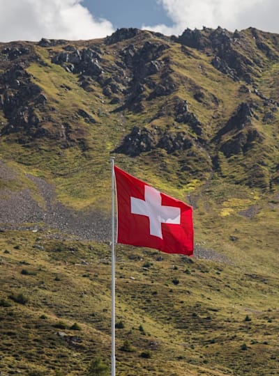 A Swiss flag flies on the Lenzerheide downhill course during the the UCI MTB World Championship on September 6, 2018.