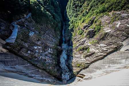 Looking down a deep gorge to a river.