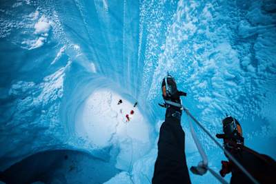 Christian Pondella hangs on a rope in a moulin during Will Gadd's trip to explore the Greenland ice cap in August 2018.