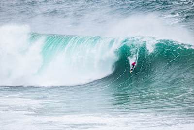 Lucas Chianca takes a drop at the Nazare Tow Challenge